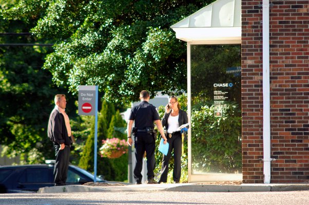 Southampton Town Police at the scene of a bank robbery at Chase Bank in Hampton Bays on Friday afternoon.  DANA SHAW