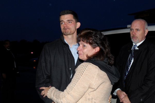 Anthony Oddone is reunited with his mother after posting bail in December.