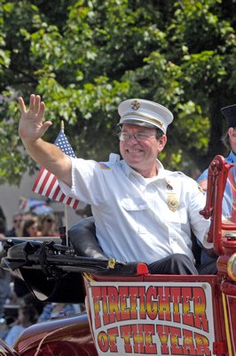 Firefighter of the Year Brian Cooke at the Southampton July 4th parade on Thursday. DANA SHAW