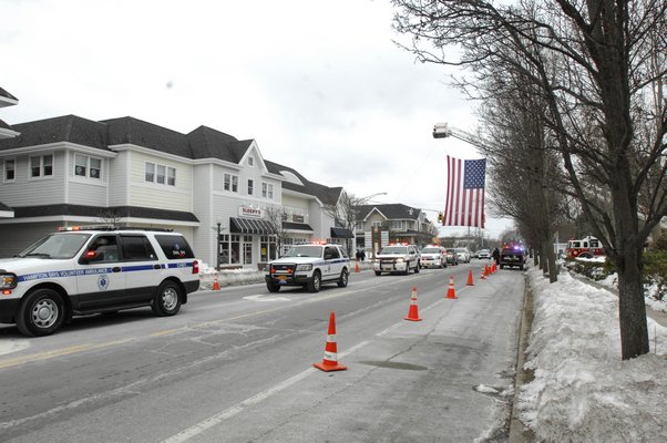 The funeral procession from the Hampton Bays Volunteer Ambulance Headqurters to St Rosalie's Church on Saturday morning.
