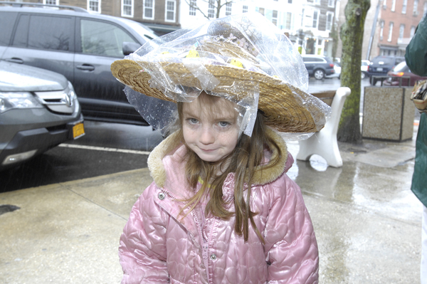 Young Emma Kraszewski came prepared for the downpour at the Sag habor Easter bonnet Parade on Saturday afternoon.