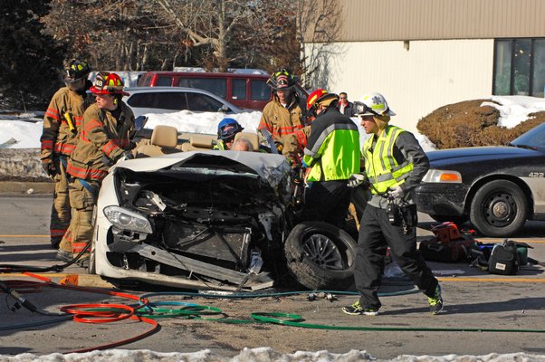 The Southampton Fire Department work to extricate the drive of the accident on County Road 39 this afternoon.  DANA SHAW