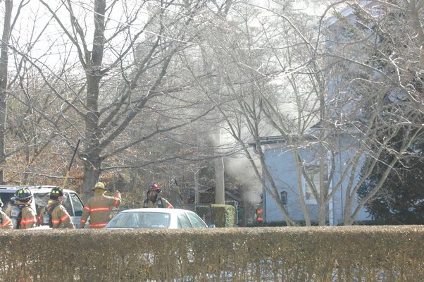 The Southampton Fire Department responds to a house fire on Powell Avenue.  DANA SHAW