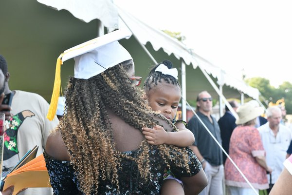 Aziza El hugs her dad after graduation on Sunday.