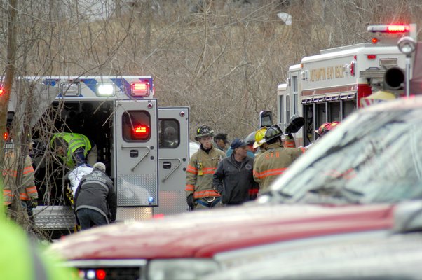 The Southampton Fire Departmet and the Southampton Volunteer Ambulance respond to the accident at the corner of Montauk Highway and East Gate Road in Southampton Village on Wednesday afternoon.  DANA SHAW