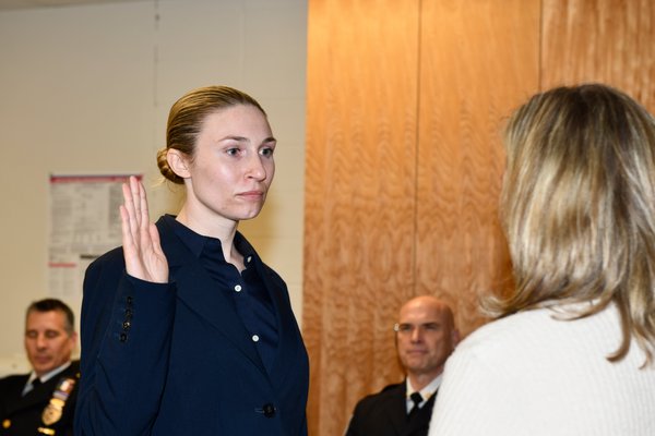 Officer Caryl Pfeiffer is sworn in.