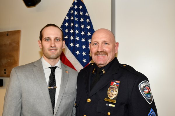 Officer Ryan Miller with his father Sergeant Steve Miller.