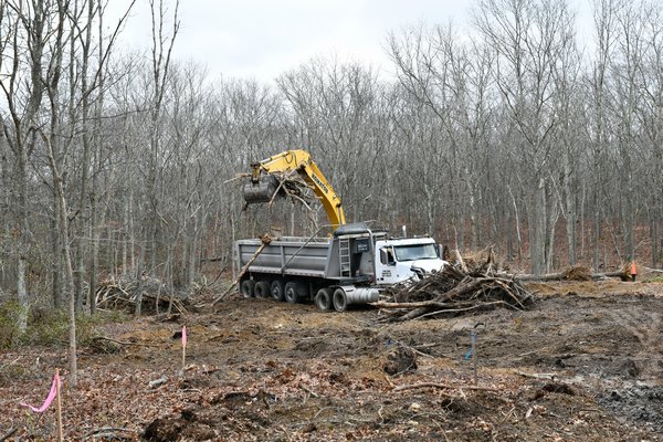 The Suffolk County Water Authority is clearing land on a county owned easement next to Noyac Hills County Park in Water Mill for a new pump station. DANA SHAW
