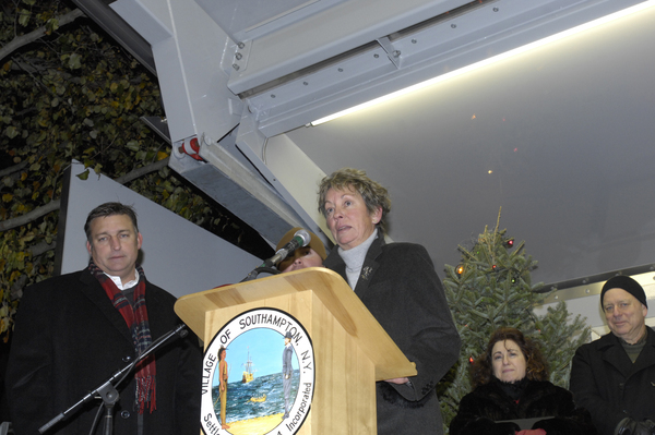 Mayor Mark Epley and Margaret McMahon light the tree in Agawam Park. DANA SHAW PHOTOS
