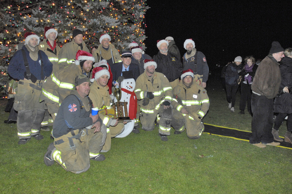 The Hampton Bays Fire Department with the trophy for best truck for the 