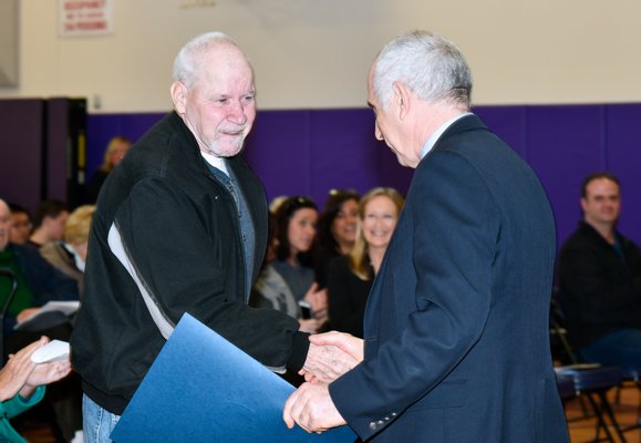 Robert Fabula receives his diploma from Hampton Bays High School.