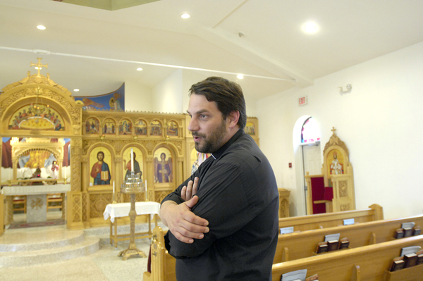Father Constantine Lazarakis in the church's sanctuary. 