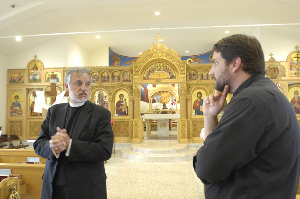 Father Alexander Karloutsos and Father Constantine Lazarakis in the church's sanctuary.