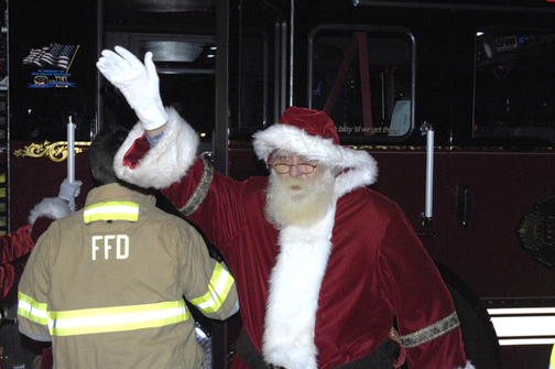 Santa arrives with the help of the Flanders Fire Department.  DANA SHAW
