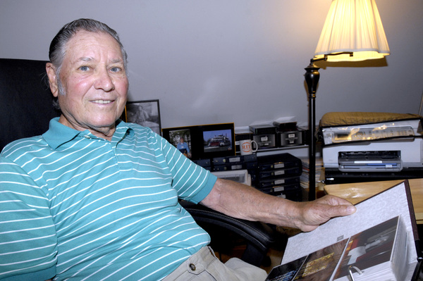 Chet Yastrzemski with photos that he took during his recent trip to Normandy.  DANA SHAW