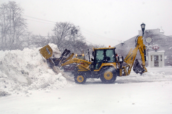The CVS parking lot in Southampton Village being plowed early Wednesday morning.  DANA SHAW