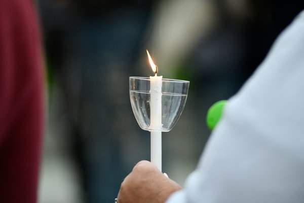 Friends and family member attended a candlelight vigil in good Ground Park on Saturday evening in remembrance of those killed in the opioid crisis.