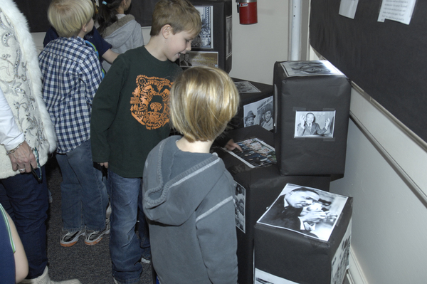Students from Southampton Elementary School third grade and kindergarten classes look over the Rev. Martin Luther King display at village hall.  DANA SHAW