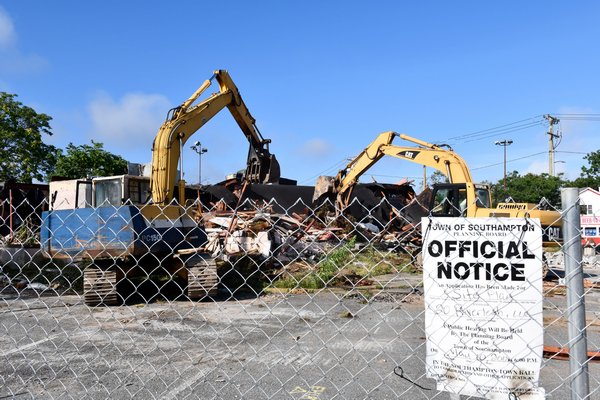The former Riverboat Diner in on the traffic circle in Riverside is demolished on Tuesday morning.  DANA SHAW