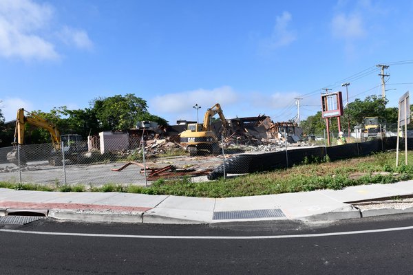 The former Riverboat Diner in on the traffic circle in Riverside is demolished on Tuesday morning.  DANA SHAW
