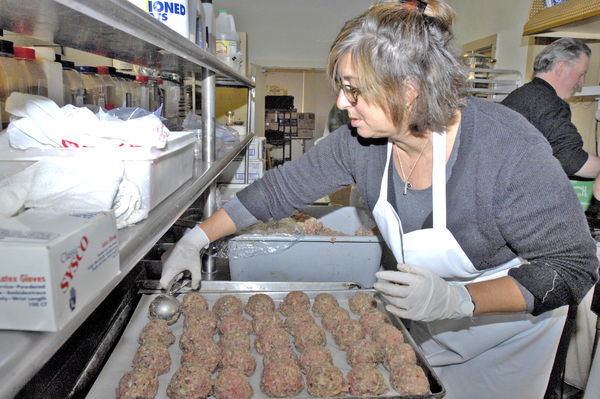 Rotarian Deb Capone makes meatballs for the Rotary Spaghetti Dinner. DANA SHAW