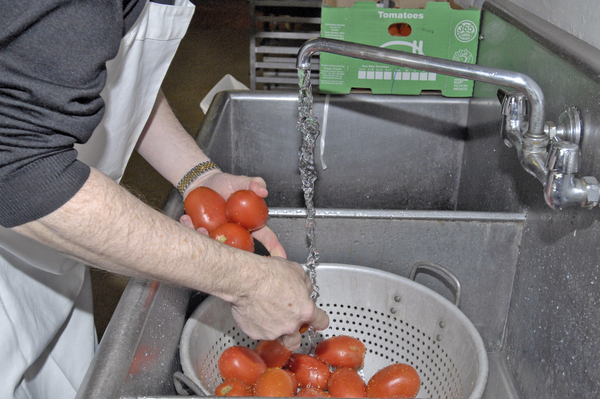 Rotarian Dermot Dolan prepares tomatoes for the annual Spaghetti Dinner. DANA SHAW