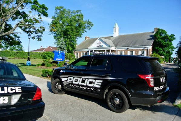 Southampton Town Police at the scene of a bank robbery at Chase Bank in Hampton Bays on Friday afternoon.  DANA SHAW