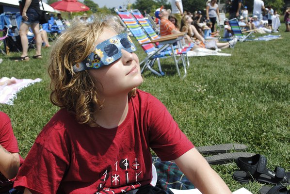People lined up early Monday morning at the East Hampton Library to get protective glasses to view the eclipse. COURTESY ROGER EULAU