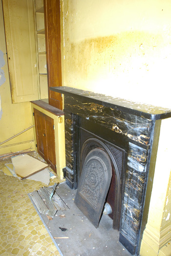 One of the many fireplaces original to the house.