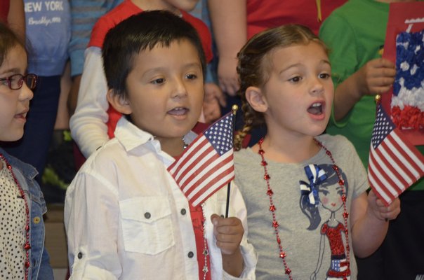 Tuckahoe students sang patriotic songs for local veterans at a Memorial Day breakfast in the school cafeteria on Friday. BY ERIN MCKINLEY