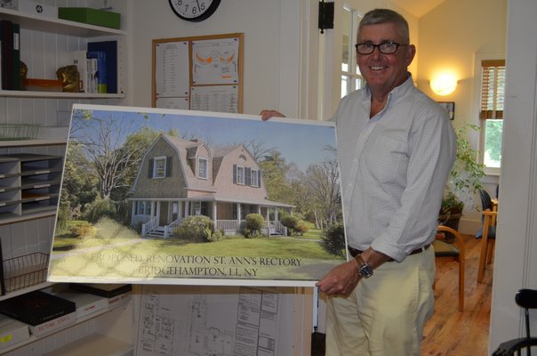 Reverend Tim Lewis with a model of the future recctory. KELLY ZEGERS