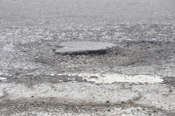 Potholes on Montauk Highway in Wainscott.  SHAYE WEAVER