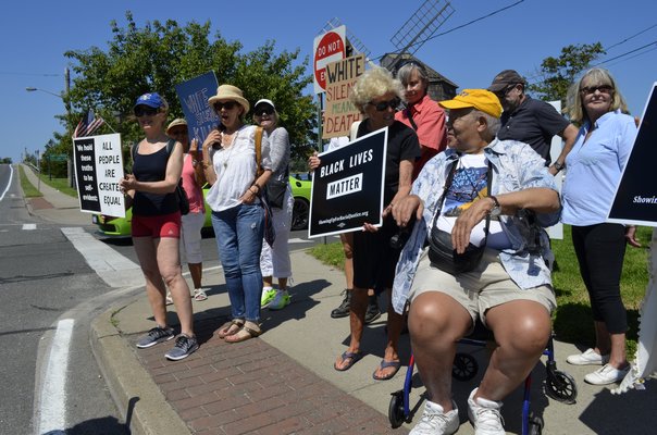 Black Lives Matter rally goers in Sag Harbor move to a more visible spot. KELLY ZEGERS