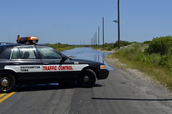 A portion of Dune Road between Tiana Beach and the Ponquogue Bridge was closed on Thursday. ALEXA GORMAN