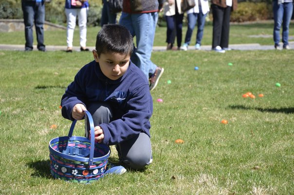 Kids on the hunt for eggs at the LVIS Easter Egg Hunt on Saturday. SHAYE WEAVER