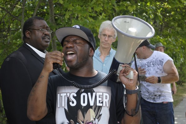 Co-organizer Willie Jenkins of Bridgehampton leads a chant during a Black Lives Matter rally in Westhampton Beach on Sunday. AMANDA BERNOCCO