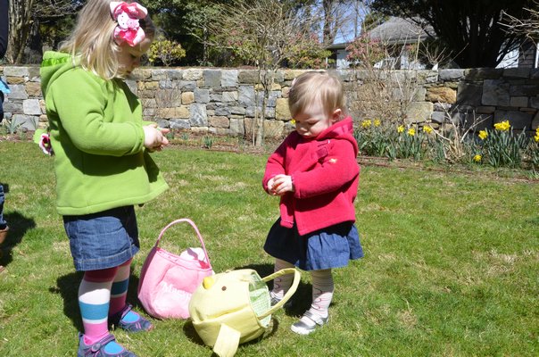 Sisters Brynn and Maeve Tupper go through their find from the LVIS Easter Hunt on Saturday. SHAYE WEAVER