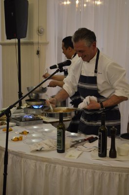 Chef Christian Mir of the Stone Creek Inn gives a presentation at the Taste of Tuckahoe event on Friday night. BY ERIN MCKINLEY