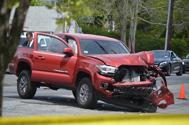 Montauk Highway in East Quogue was closed on Thursday morning after two people were injured in a car crash at the intersection of Vail Avenue. BY ERIN MCKINLEY