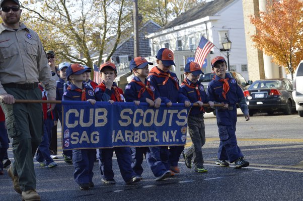 The Sag Harbor Veterans' Day Parade made its way down Main and Bay streets in the village Tuesday morning and featured local war veterans as well as girl and boy scouts troops. ALYSSA MELILLO