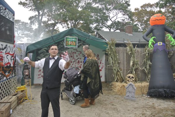 Tom rosante welcomes visitors to the Scarlyand Boulevard hunted house.  DANA SHAW