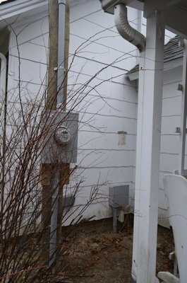 The pole outside Etta Tuttle's home in Eastport sits about a foot away from the house. ALEXA GORMAN