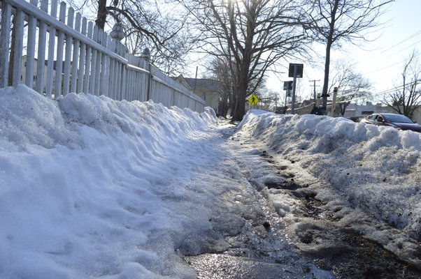 While most sidewalks along Montauk Highway in Bridgehampton have been cleared of snow
