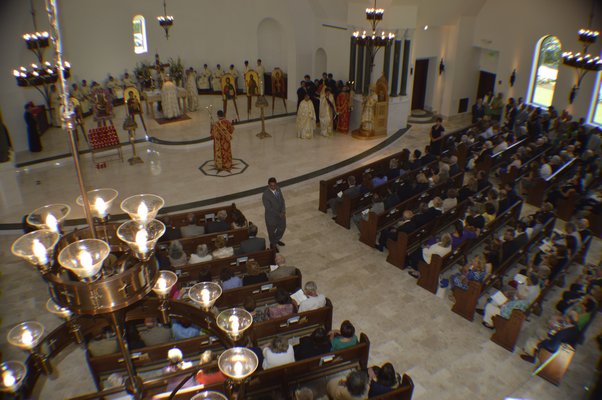 The Dormition of the Virgin Mary Greek Orthodox Church of the Hamptons held its official door opening ceremony on Thursday morning. Archbishop Demetrios of America presided over the ceremonies. More than 250 people attended. BRANDON B. QUINN