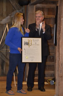 Assemblyman Fred Thiele presented the Andrew Carnegie Hero Fund Medal to Katie Osiecki on Thursday night. SHAYE WEAVER