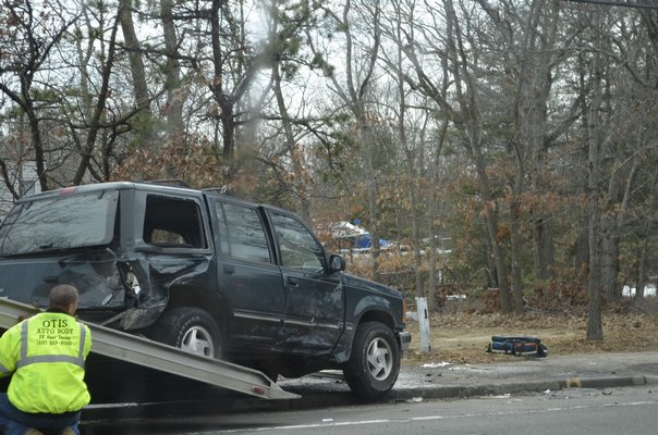 An SUV was towed away after a crash on Flanders Road on Wednesday. ALEXA GORMAN