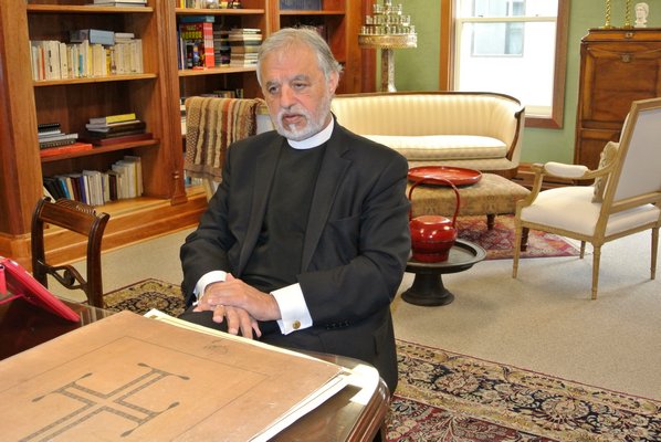 Fr. Alexander Karloutsos in the library of the of the Dormition of the Virgin Mary Greek Orthodox Church of the Hamptons.   DANA SHAW