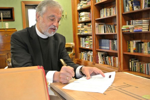 Fr. Alexander Karloutsos in the library of the of the Dormition of the Virgin Mary Greek Orthodox Church of the Hamptons.   DANA SHAW