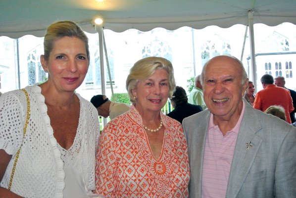 Maire and Kathleen Glinka with Joe Taranto at the Sacred Hearts of Jesus and Mary Parish Tent Party on Saturday night. DANA SHAW