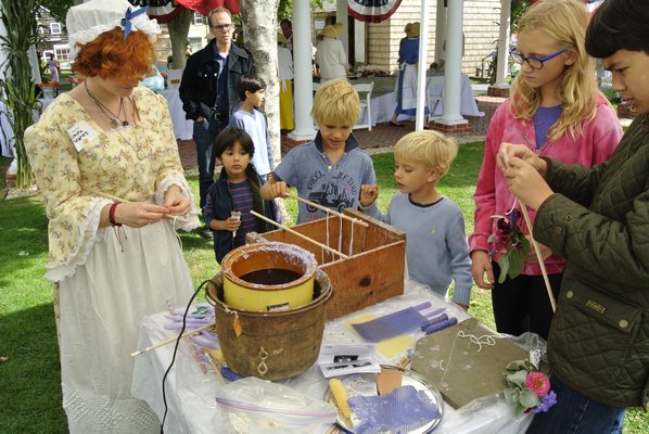Candle making at the Southampton Historical Museum's Harvest Day Fair.